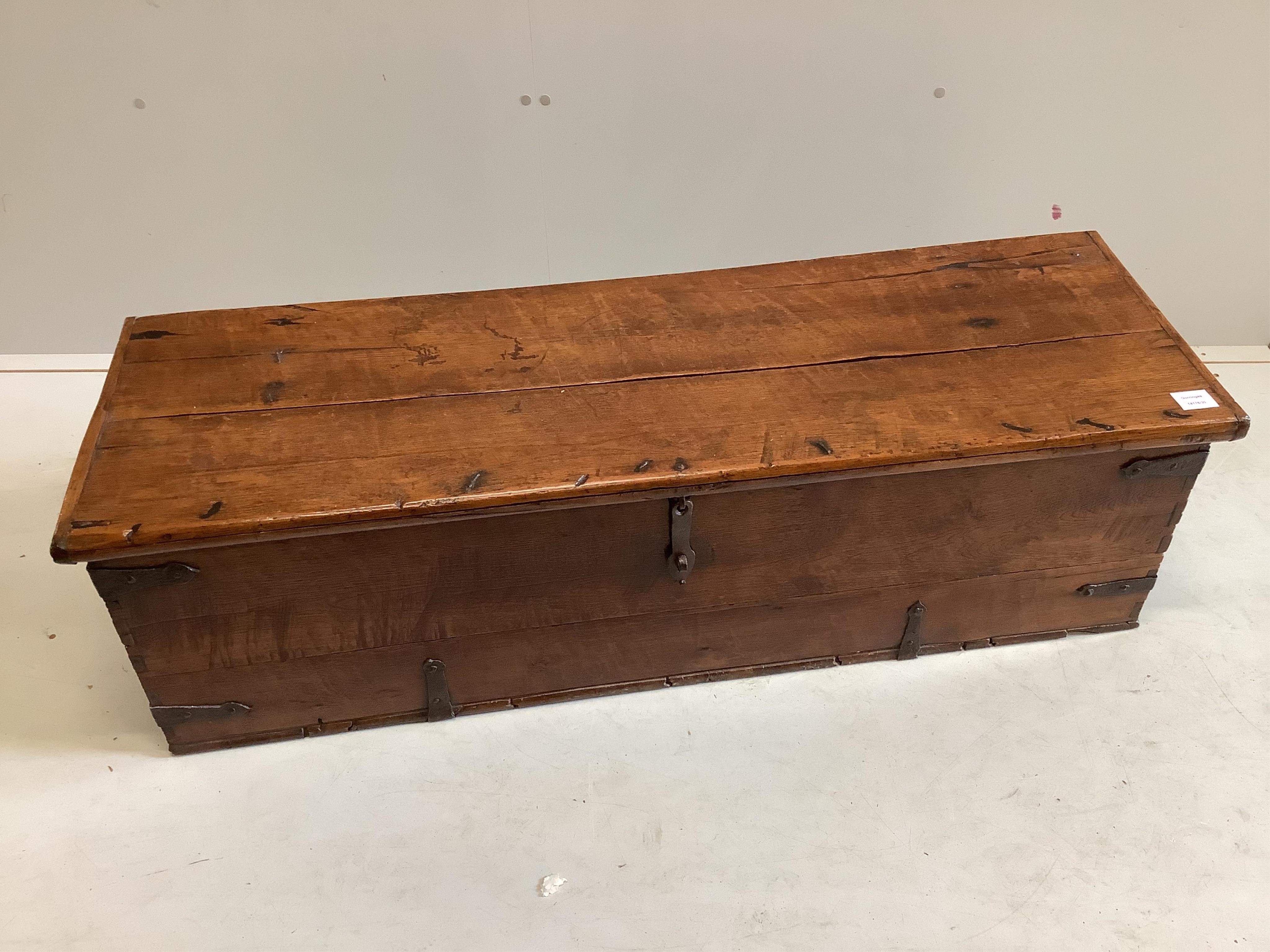 An iron bound oak coffer, width 123cm, depth 38cm, height 37cm. Condition - fair
